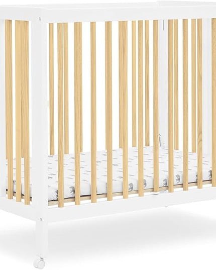 Delta Children Mia Portable Folding Mini Crib with 1.5-Inch Mattress - Greenguard Gold Certified, Bianca White/Natural - LeafyLoom