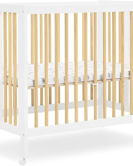 Delta Children Mia Portable Folding Mini Crib with 1.5-Inch Mattress - Greenguard Gold Certified, Bianca White/Natural - LeafyLoom
