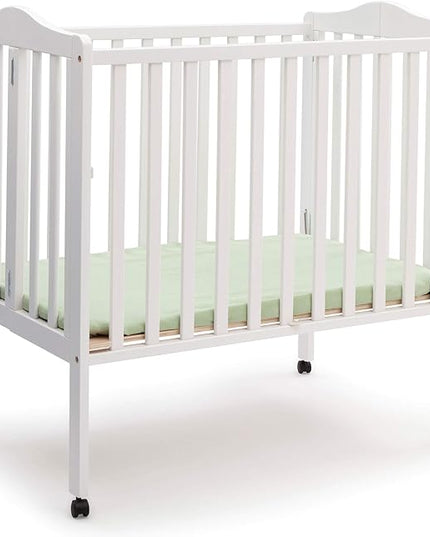 Delta Children Folding Portable Mini Baby Crib with 1.5-inch Mattress - Greenguard Gold Certified, White - LeafyLoom