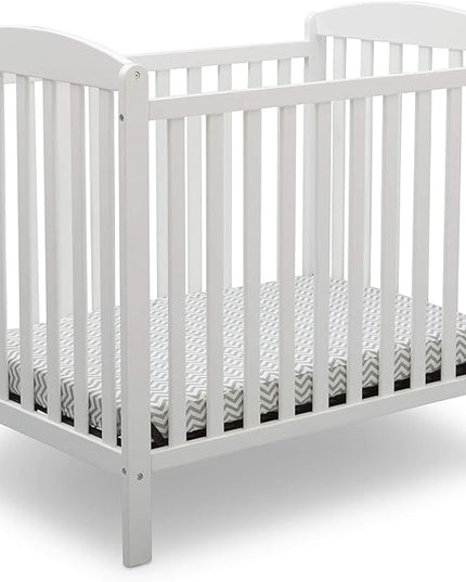Delta Children Emery Mini Convertible Baby Crib with 2.75-inch Mattress, Bianca White - LeafyLoom