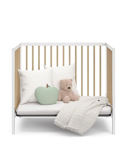 Graco Teddi 4-in-1 Convertible Mini Crib with Bonus Water-Resistant Mattress (White with Driftwood) – GREENGUARD Gold Certified, 2.75-Inch Mattress Included, Convenient Size, Easy 30-Minute Assembly - LeafyLoom