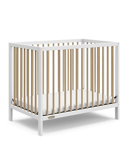 Graco Teddi 4-in-1 Convertible Mini Crib with Bonus Water-Resistant Mattress (White with Driftwood) – GREENGUARD Gold Certified, 2.75-Inch Mattress Included, Convenient Size, Easy 30-Minute Assembly - LeafyLoom
