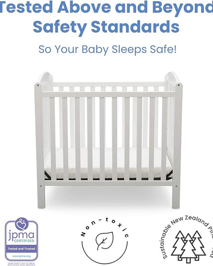 Delta Children Emery Mini Convertible Baby Crib with 2.75-inch Mattress, Bianca White - LeafyLoom