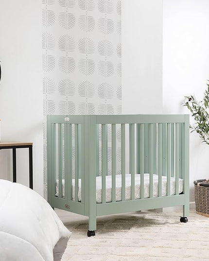 Babyletto Origami Mini Portable Crib Folding with Wheels in Light Sage, 2 Adjustable Mattress Positions, Greenguard Gold Certified - LeafyLoom