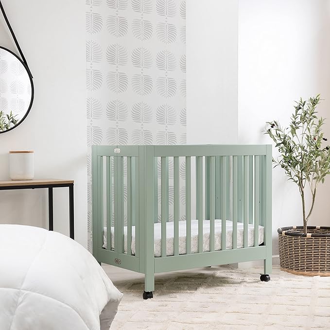 Babyletto Origami Mini Portable Crib Folding with Wheels in Light Sage, 2 Adjustable Mattress Positions, Greenguard Gold Certified - LeafyLoom