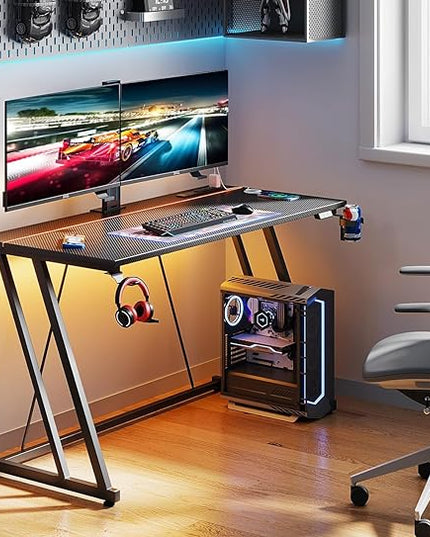 MOTPK Gaming Desk with LED Lights & Power Outlet, Computer Desk 47inch for Small Space, Cheap Gaming Table with Carbon Fiber Texture, Kids Desk Gift for Boys Men, Black - LeafyLoom