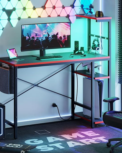 Bestier Gaming Desk with Power Outlets, 44 Inch Led Gamer Desk with 4 Tiers Reversible Shelves, PC Gaming Table with Headset Hook & Side Storage Bag for Bedroom (Black 3D Carbon Fiber) - LeafyLoom