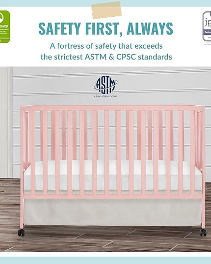 Quinn Full-Size Folding Crib in Blush Pink, Removeable Wheels, Modern Nursey, Adjustable Mattress Support, Portable Crib, Patented Folding System - LeafyLoom