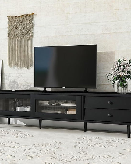 Merax Chic Elegant Design TV Stand with Sliding Fluted Glass Doors and Ample Space, Slanted Drawers Media Console for Televisions Up to 75", Modern Storage Cabinet, 70.86 inch Length, Black - LeafyLoom