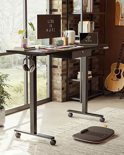 FEZIBO 55x 24 Inches Standing Desk with Drawer, Adjustable Height Electric Stand up Desk with Storage, Sit Stand Home Office Desk, Ergonomic Computer Desk, Black - LeafyLoom