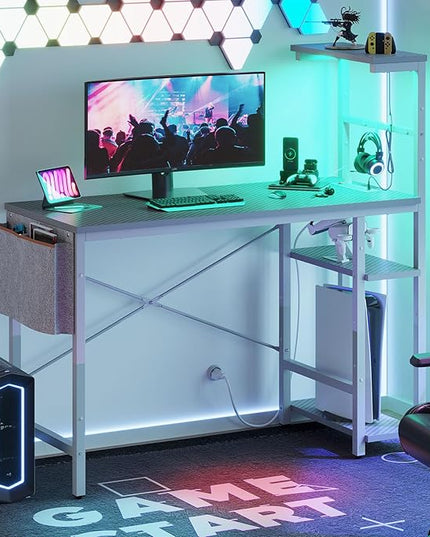 Bestier Gaming Desk with Power Outlets, 44 Inch Led Gamer Desk with 4 Tiers Reversible Shelves, PC Gaming Table with Headset Hook & Side Storage Bag for Bedroom (Grey 3D Carbon Fiber) - LeafyLoom