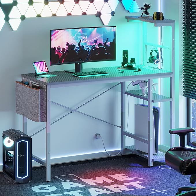 Bestier Gaming Desk with Power Outlets, 44 Inch Led Gamer Desk with 4 Tiers Reversible Shelves, PC Gaming Table with Headset Hook & Side Storage Bag for Bedroom (Grey 3D Carbon Fiber) - LeafyLoom