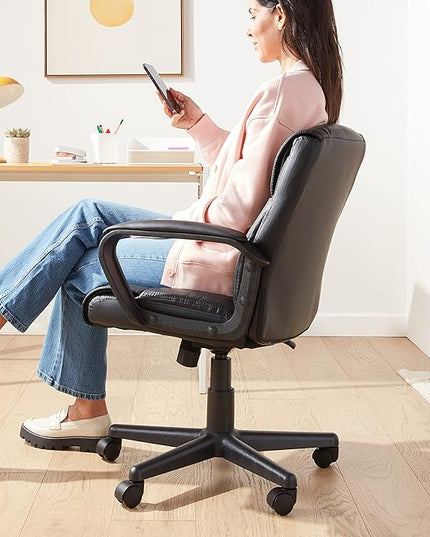 Amazon Basics Office Computer Task Desk Chair with Padded Armrests, Mid-Back, Adjustable, 360 Swivel, Rolling, 275 Pound Capacity, BIFMA Certified, 24.2"D x 24"W x 34.8"H, Black Faux Leather - LeafyLoom