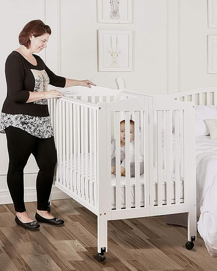 3 in 1 Portable Folding Stationary Side Crib in White, Greenguard Gold Certified, Safety Wheel with Locking Casters, Convertible, 3 Mattress Heights - LeafyLoom