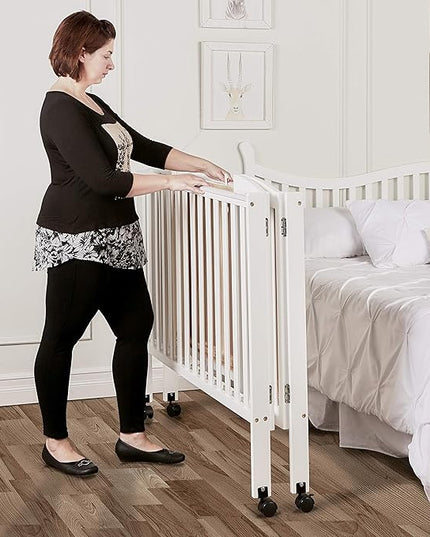 3 in 1 Portable Folding Stationary Side Crib in White, Greenguard Gold Certified, Safety Wheel with Locking Casters, Convertible, 3 Mattress Heights - LeafyLoom