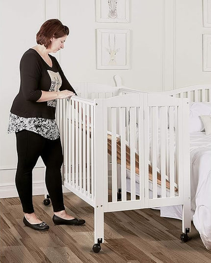 3 in 1 Portable Folding Stationary Side Crib in White, Greenguard Gold Certified, Safety Wheel with Locking Casters, Convertible, 3 Mattress Heights - LeafyLoom