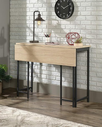 Sauder North Avenue Table with Drop Leaf, L: 47.50" x W: 28.38" x H: 36.13", Charter Oak Finish - LeafyLoom