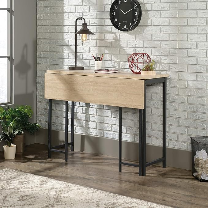 Sauder North Avenue Table with Drop Leaf, L: 47.50" x W: 28.38" x H: 36.13", Charter Oak Finish - LeafyLoom