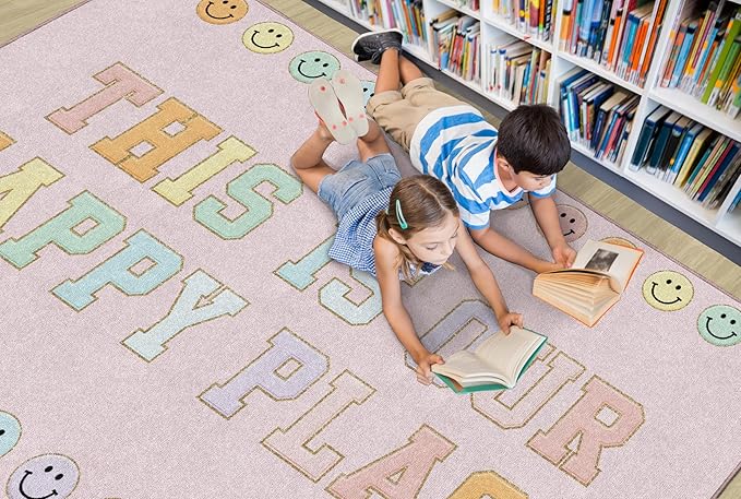 Flagship Carpets Schoolgirl Style This is Our Happy Place on Pink Educational Area Rug for Kids Room Seating Décor, Children's Classroom, Play Carpet for Teaching and Playroom, 5' x 7'6" - LeafyLoom