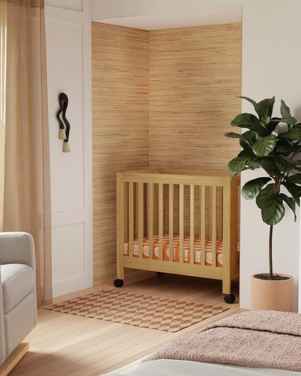 Babyletto Origami Mini Portable Crib Folding with Wheels in Honey, 2 Adjustable Mattress Positions, Greenguard Gold Certified - LeafyLoom