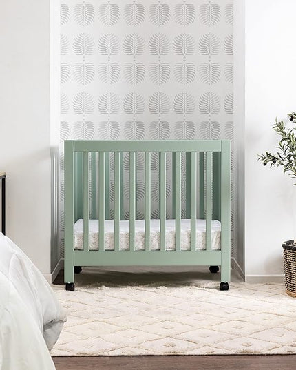 Babyletto Origami Mini Portable Crib Folding with Wheels in Light Sage, 2 Adjustable Mattress Positions, Greenguard Gold Certified - LeafyLoom